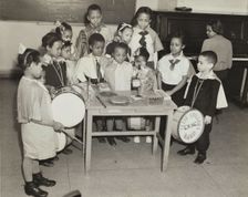 Drum students around a table, 1938. Creator: Andrew Herman