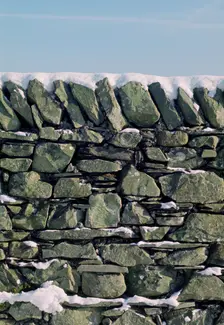 Dry stone wall in winter. Creator: Tony Evans