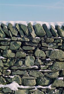 Dry stone wall in winter. Creator: Tony Evans