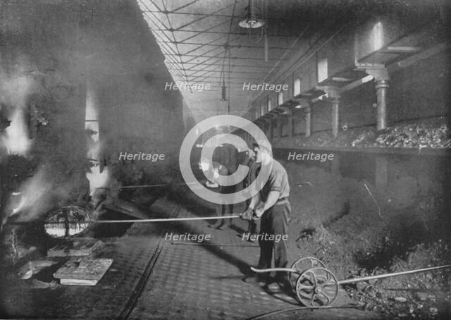 Drawing retorts by hand, South Metropolitan Gasworks, Peckham, London, 1903 (1903). Artist: Unknown.