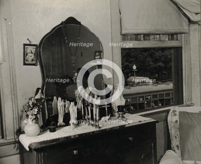 Dresser in the bedroom of Mrs. Ella Watson, a government charwoman, Washington, D.C., 1942. Creator: Gordon Parks.