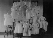 Dresses, possibly made by students in a Washington, D.C. school, on display, (1899?). Creator: Frances Benjamin Johnston