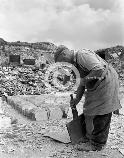 Dressing slate at Trebarwith Slate Quarry, Cornwall, 1959.  Creator: Michael Walters.