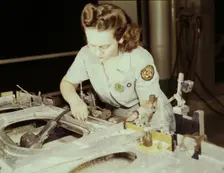 Drilling a wing bulkhead for a transport plane at the Consolidated Air..., Fort Worth, Texas, 1942. Creator: Howard Hollem