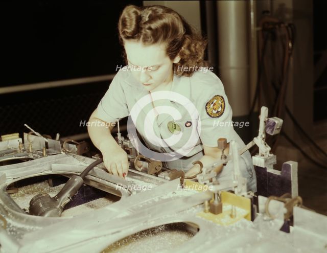 Drilling a wing bulkhead for a transport plane at the Consolidated Air..., Fort Worth, Texas, 1942. Creator: Howard Hollem.