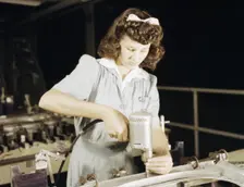 Drilling a wing bulkhead for a transport plane at the Consolidated Air..., Fort Worth, Texas, 1942. Creator: Howard Hollem