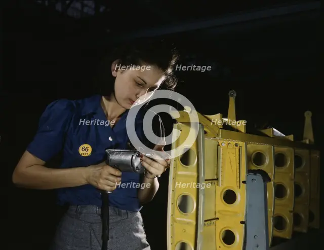 Drilling horizontal stabilizers...this woman worker at Vultee-Nashville..., Tennessee, 1943. Creator: Alfred T Palmer.