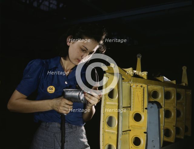 Drilling horizontal stabilizers...this woman worker at Vultee-Nashville..., Tennessee, 1943. Creator: Alfred T Palmer.