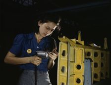 Drilling horizontal stabilizers...this woman worker at Vultee-Nashville..., Tennessee, 1943. Creator: Alfred T Palmer