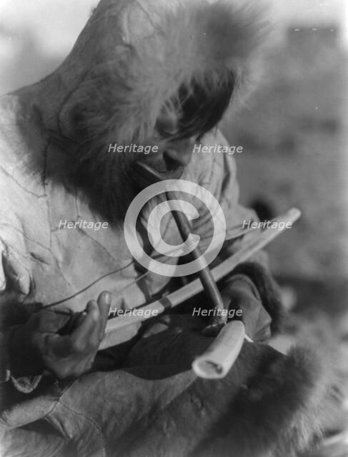 Drilling ivory-King Island, c1929. Creator: Edward Sheriff Curtis.