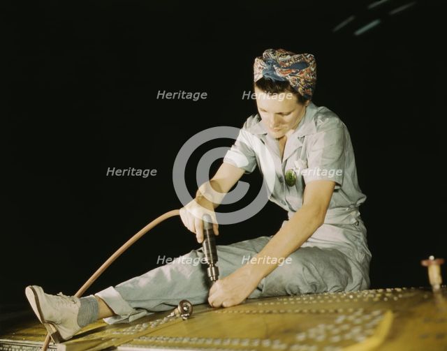 Drilling on a Liberator Bomber, Consolidated Aircraft Corp., Fort Worth, Texas, 1942. Creator: Howard Hollem.