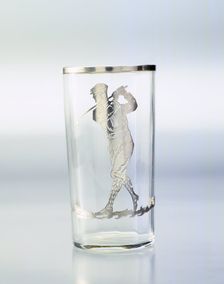 Drinking glass with silver overlay of golfer, United States, c1920. Creator: Unknown