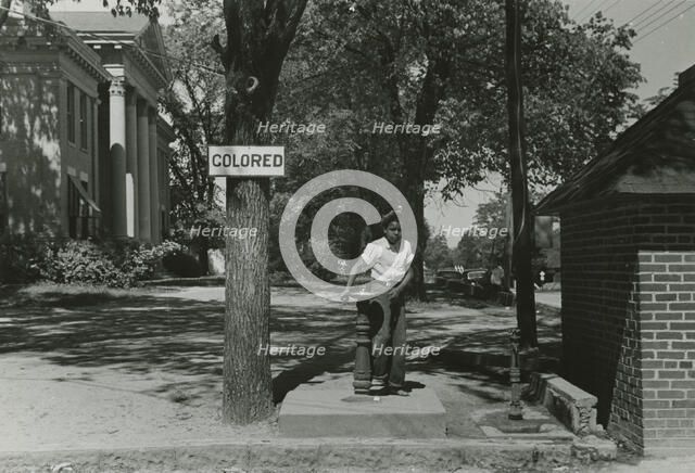 Drinking fountain on the county courthouse lawn, Halifax, North Carolina, 1938-04. Creators: Farm Security Administration, John Vachon.
