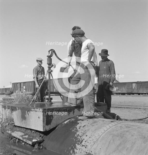 Drinking water for the whole town..., Tulelake, Siskiyou County, California, 1939. Creator: Dorothea Lange.