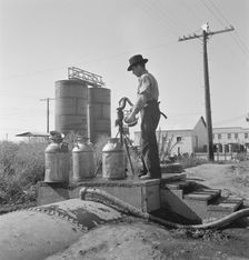 Drinking water for the whole town..., Tulelake, Siskiyou County, California, 1939. Creator: Dorothea Lange