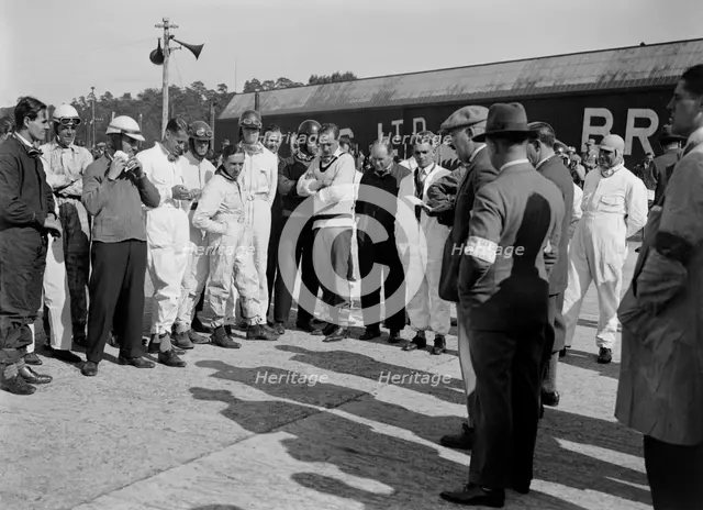 Drivers being addressed at the JCC 200 Mile Race, Brooklands, 1926. Artist: Bill Brunell.