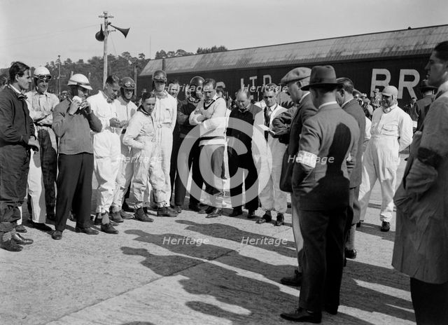 Drivers being addressed at the JCC 200 Mile Race, Brooklands, 1926. Artist: Bill Brunell.