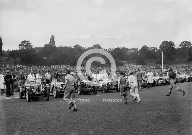 Drivers running to their cars at the start of a race at Crystal Palace, London, 1939. Artist: Bill Brunell.