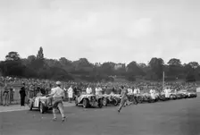 Drivers running to their cars at the start of the Imperial Trophy race, Crystal Palace, 1939. Artist: Bill Brunell