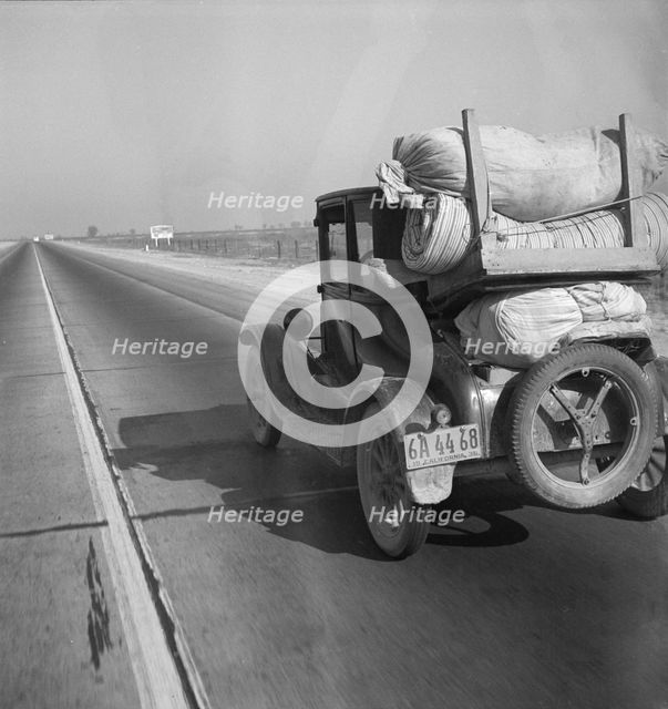 Drought refugee's car on U.S. Highway 99 between Bakersfield and Famoso, California, 1936. Creator: Dorothea Lange.