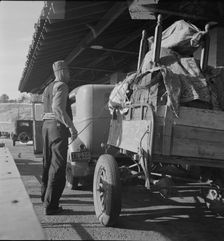 Drought refugees are stopped at the inspection station in Yuma, Arizona, 1937. Creator: Dorothea Lange