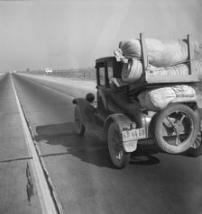 Drought refugee's car on U.S. Highway 99 between Bakersfield and Famoso, California, 1936. Creator: Dorothea Lange