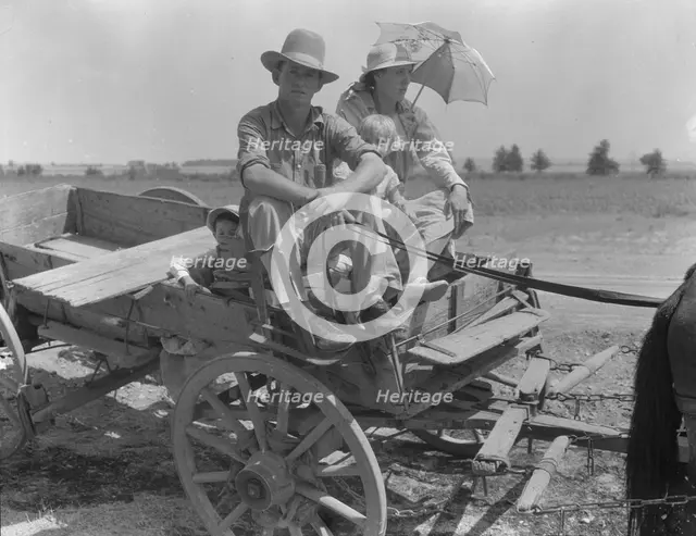 Drought-stricken farmer and family near Muskogee, Oklahoma, 1939. Creator: Dorothea Lange.