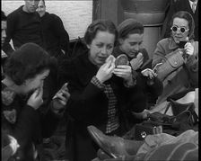 Dutch Refugees Fleeing Aboard Ships in the Netherlands. Women Are Applying Makeup, 1940. Creator: British Pathe Ltd