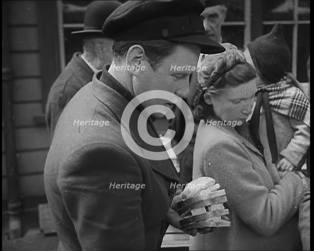 Dutch Refugees Receiving Food at a Reception Centre in the United Kingdom, 1940. Creator: British Pathe Ltd.