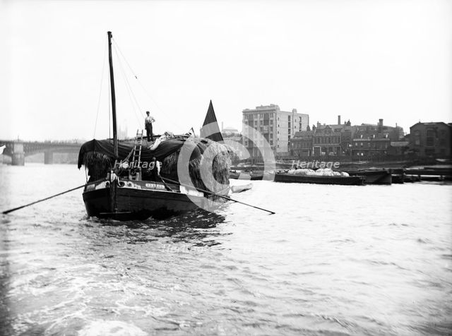 Dumpy barge on the Thames loaded with hay or esparto, London, c1905. Artist: Unknown
