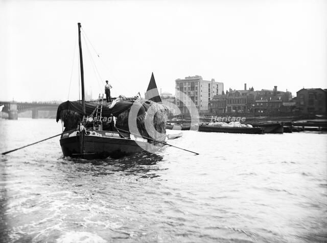 Dumpy barge on the Thames loaded with hay or esparto, London, c1905. Artist: Unknown