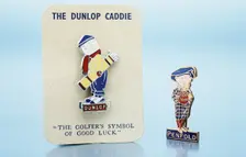 Dunlop caddie brooch and Penfold pin, British, 1920s. Creator: Unknown