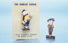 Dunlop caddie brooch and Penfold pin, British, 1920s. Creator: Unknown