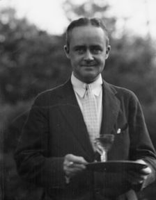 Dunning, Mr., standing outdoors, 1925 July 9. Creator: Arnold Genthe