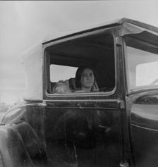 During the cotton strike, a striking picker applies for an emergency food grant, Shafter, CA, 1938. Creator: Dorothea Lange
