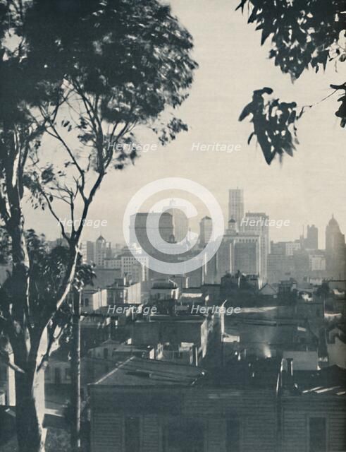 'Dwellings of Homely Timber in the Shadow of Concrete Giants', c1935. Artist: Unknown.