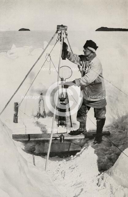 'E. W. Nelson with the Nansen-Petersen Insulated Water-Bottle', c1911, (1913). Artist: Herbert Ponting.
