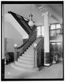 E.M. Bigsby Co. show rooms, stairway to the balcony, between 1900 and 1915. Creator: Unknown