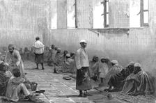 'Emin Pasha's People "At Home" in the Abbassiyeh Barrack's, Cairo 1890. Creator: Unknown