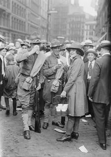 Emma Rencken "watering" soldiers, between c1915 and c1920. Creator: Bain News Service