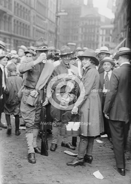 Emma Rencken "watering" soldiers, between c1915 and c1920. Creator: Bain News Service.