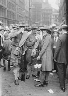 Emma Rencken "watering" soldiers, between c1915 and c1920. Creator: Bain News Service