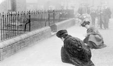 Emma Sproson (left) and a friend chalking the pavement, 1907. Creator: Unknown