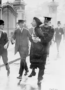 Emmeline Pankhurst arrested by Superintendent Rolfe outside Buckingham Palace, London, May 1914. Creator: Unknown