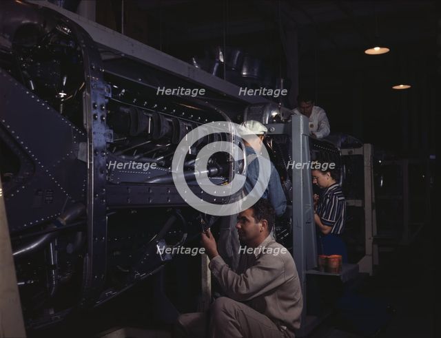 Employees at North American Aviation, Incorporated, assembling..., Inglewood, Calif., 1942. Creator: Alfred T Palmer.