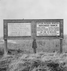 Employment signs in Spanish and English, near Fresno, California, 1933. Creator: Dorothea Lange