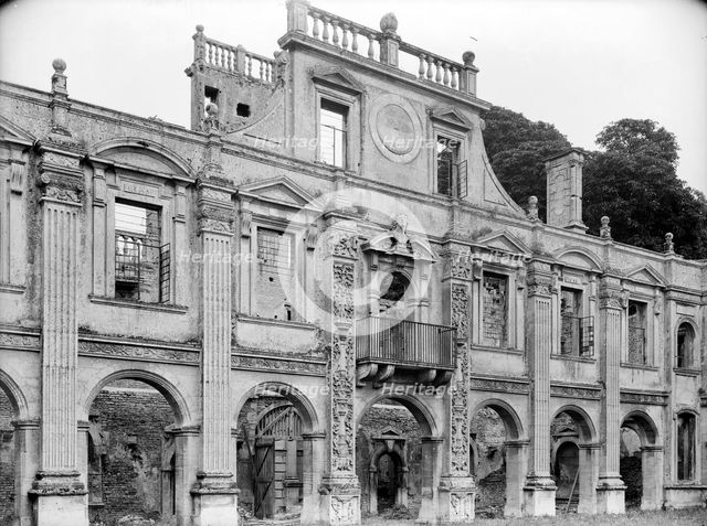 Empty shell of the north side of inner courtyard at Kirby Hall, Gretton, Northamptonshire, 1925.   Artist: Nathaniel Lloyd