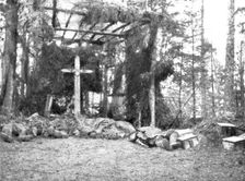 'En Alsace; Une chapelle rustique dans la foret pour abriter nos morts 1915. Creator: Unknown