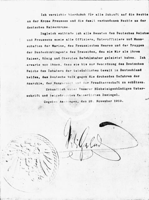 ''En Exil; L'acte d'abdication de Guillaume 11, que le kaiser dechu signa seulement le 28 novembre.. Creator: Unknown.