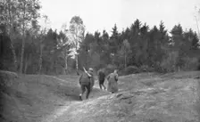 'En Foret D'Argonne; Passage dangereux a travers une clairiere 1915. Creator: Unknown